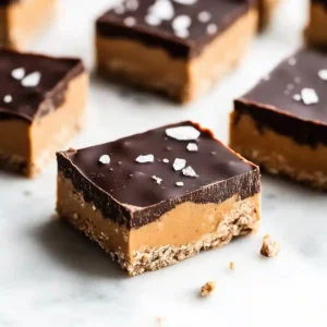 Chocolate peanut butter protein bars with chocolate topping and salt dust