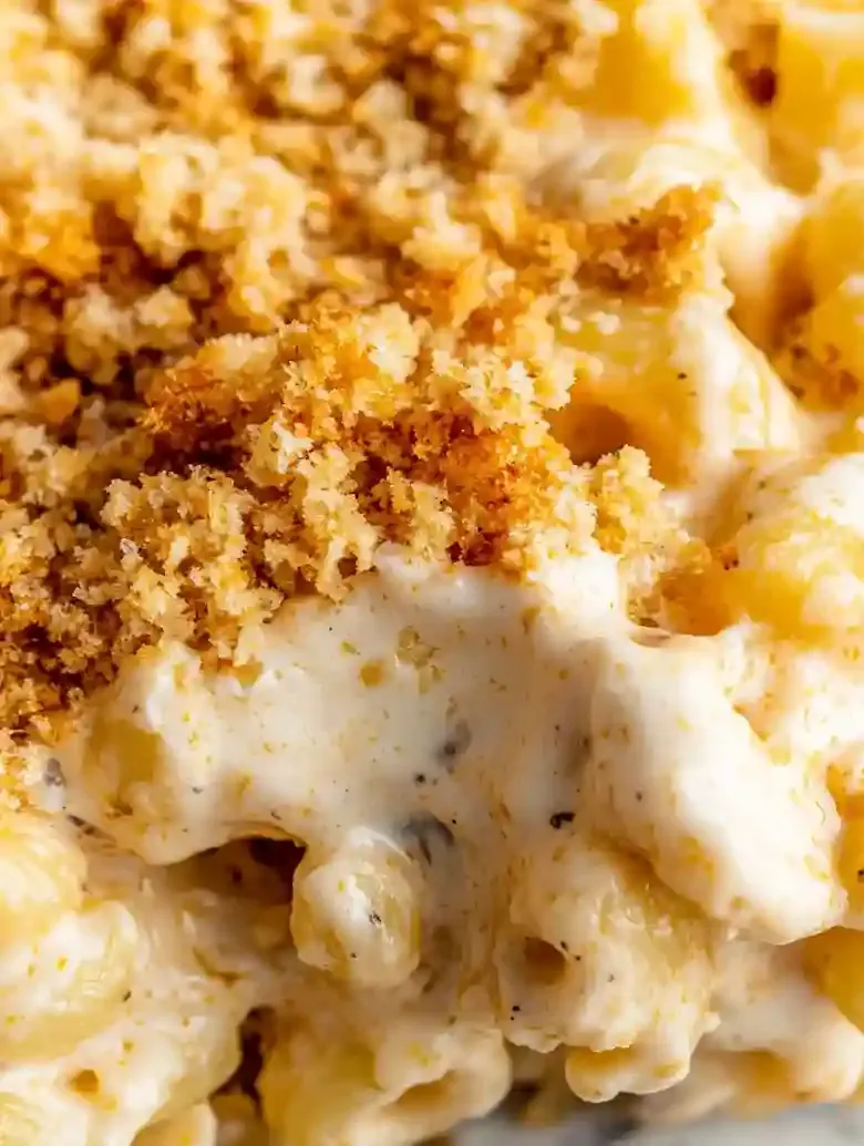 Closeup of spiral pasta in Boursin mac and cheese with crispy breadcrumb topping.